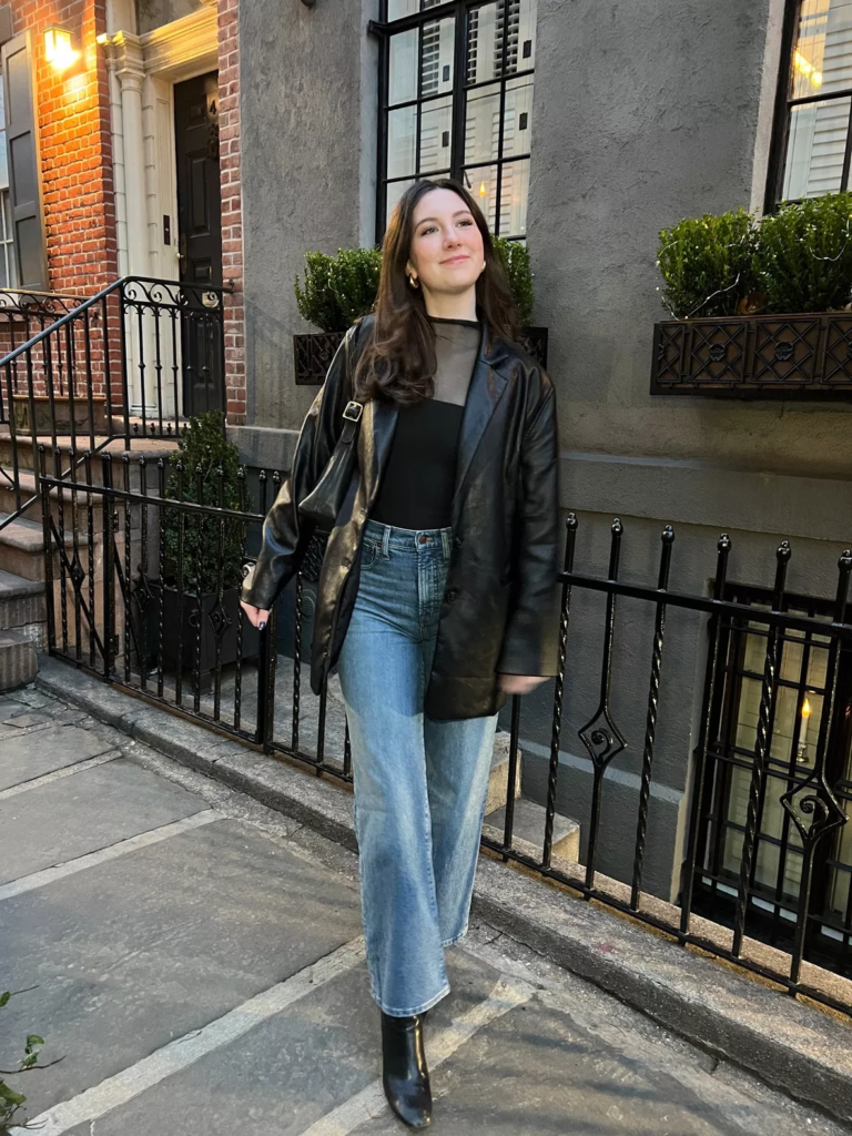 leather jacket over bodysuit + jeans